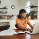 woman who is a remote worker sitting at a computer
