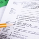 pencil in hand pointing to a list of itemized deductions on a tax form