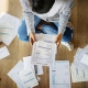 women organizing tax forms on the floor