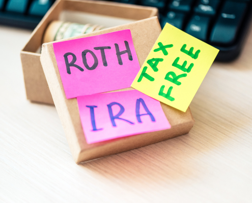 box of money with Roth IRA Tax Free written on sticky notes