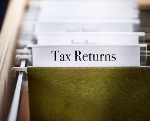 tax returns file folder in a file cabinet