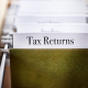 tax returns file folder in a file cabinet