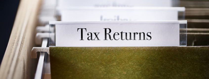 tax returns file folder in a file cabinet