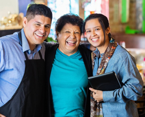 family business employees smiling in a restaurant