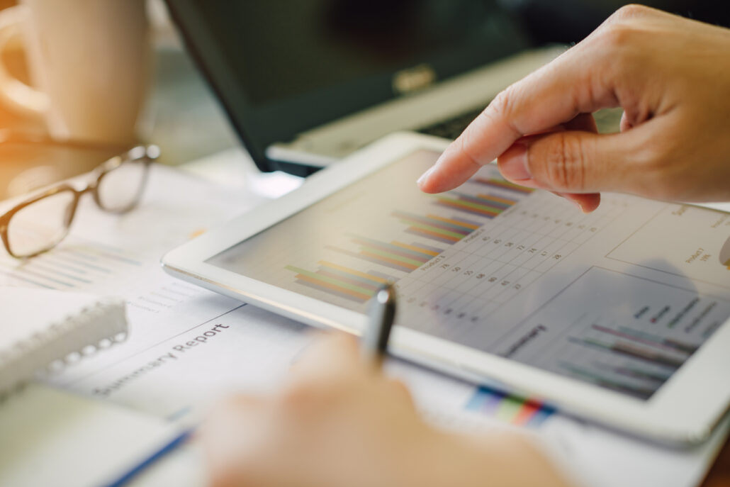 High earner reviewing a cash-flow plan and tax projections on a tablet in January